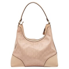 Jolie hobo Gucci Beige/Rose métallique GG Toile et cuir Moyen