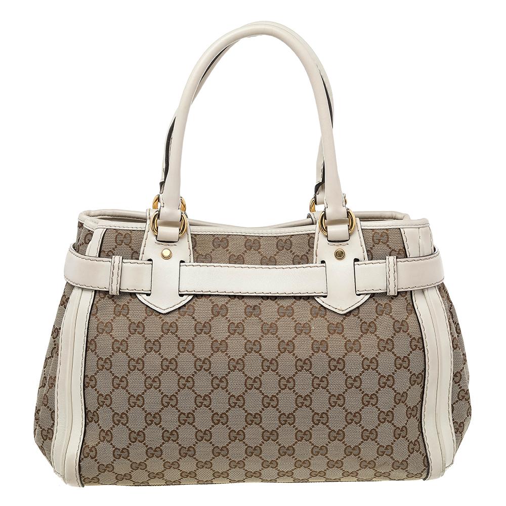 This Gucci GG Running tote is made of GG canvas and leather. It features two handles, gold-tone hardware, and a spacious interior to house all your daily essentials. The gold-tone GG logo on the front is another highlight.
