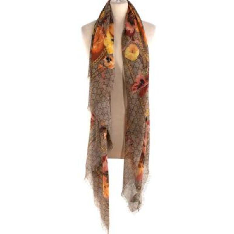 Gucci Beige & Orange Floral Oshibana Wool Scarf

- Lightweight woven wool scarf with GG monogram and motifs
- Orange and yellow-tone flower motifs
- Golden chain and horsebit motifs
- Frayed edges


- Made in Italy
- Professional dry clean only
-