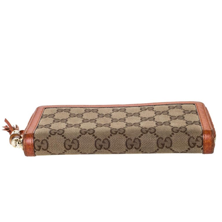 Gucci Beige/Orange GG Canvas and Leather Tassel Zip-around  display picture 1