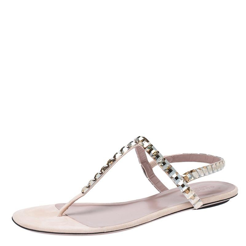 These sandals have a thong design in suede with crystals detailed on the straps. They feature buckle closure at the ankle, leather insoles and durable soles. The light colours make them visually pleasing.

Includes
Original Dustbag, Original Box