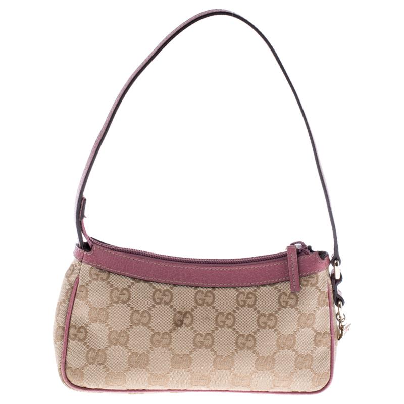 This beautifully fashioned signature GG canvas bag will surely fetch you a lot of admiration. This piece has a single handle and an ideally-sized fabric interior. You are sure to love this absolutely stylish accessory from Gucci.

Includes: The