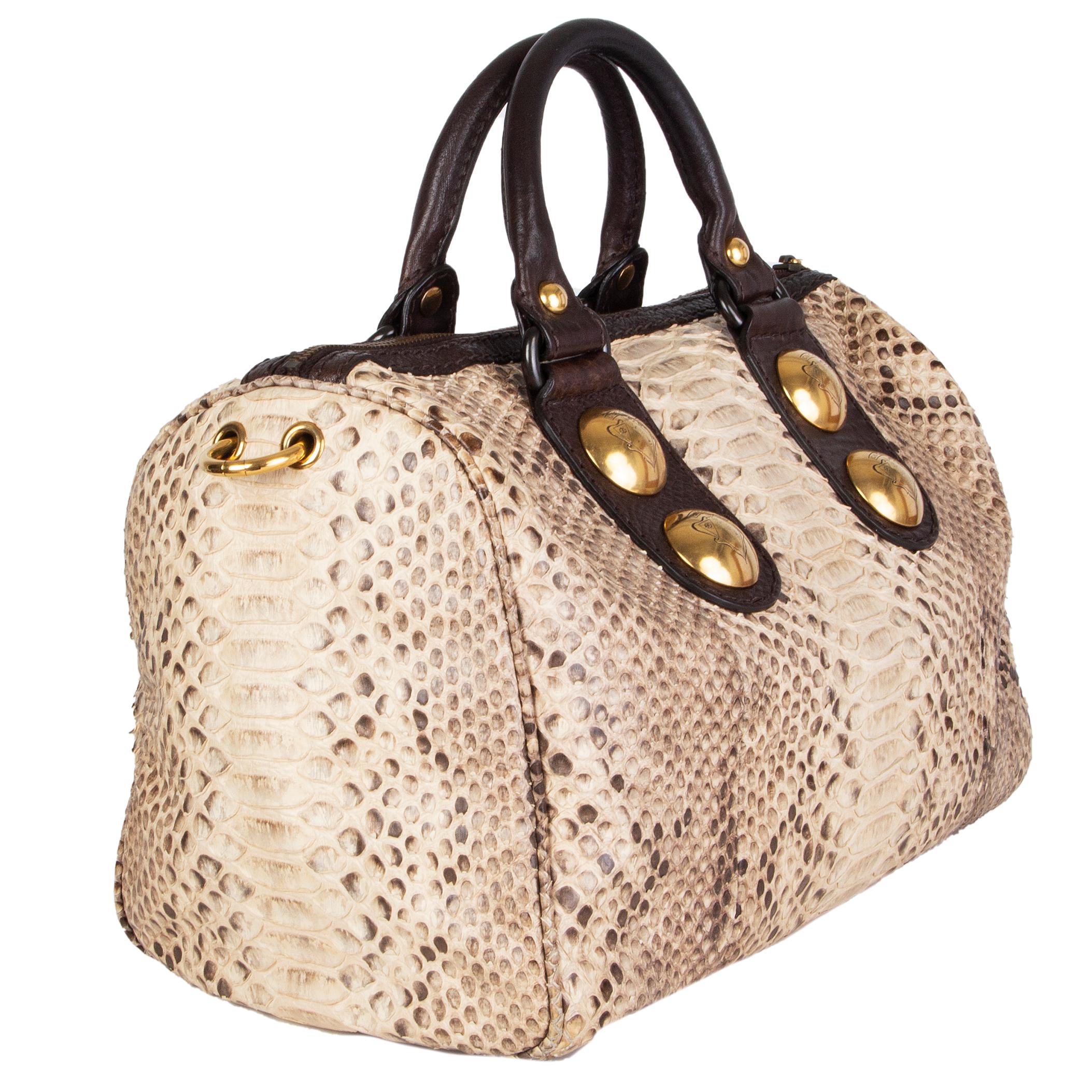 Gucci 'Python Baboushka Boston' bag in beige snakeskin with large studes. Closes with a zipper on top. Lined in black logo nylon with an open pocket against the front and a zipper pocket against the back. Has been carried with minor signs of wear to