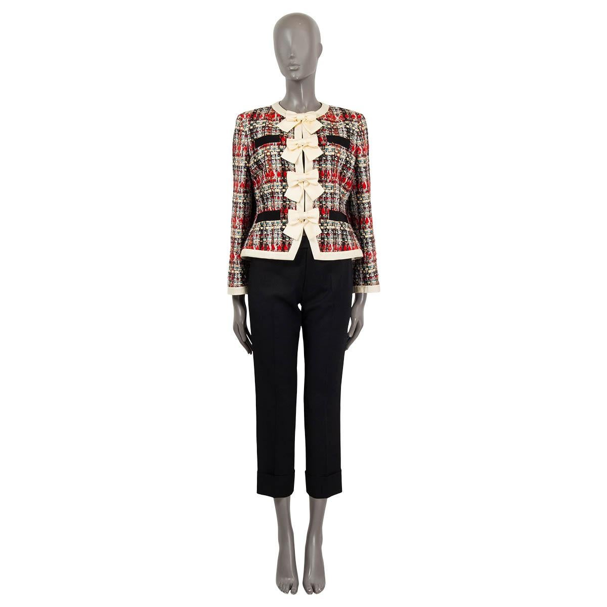 100% authentic Gucci lurex tweed jacket in vanilla, red, black, turquoise, beige and white acrylic (31%), polyester (27%), wool (17%), cotton (14%) and polyamide (11%). Features a vanilla silk twill trim with bows, four pockets with black grosgrain