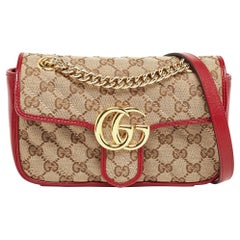 Mini bolso GG Marmont diagonal de lona y piel beige/rojo de Gucci