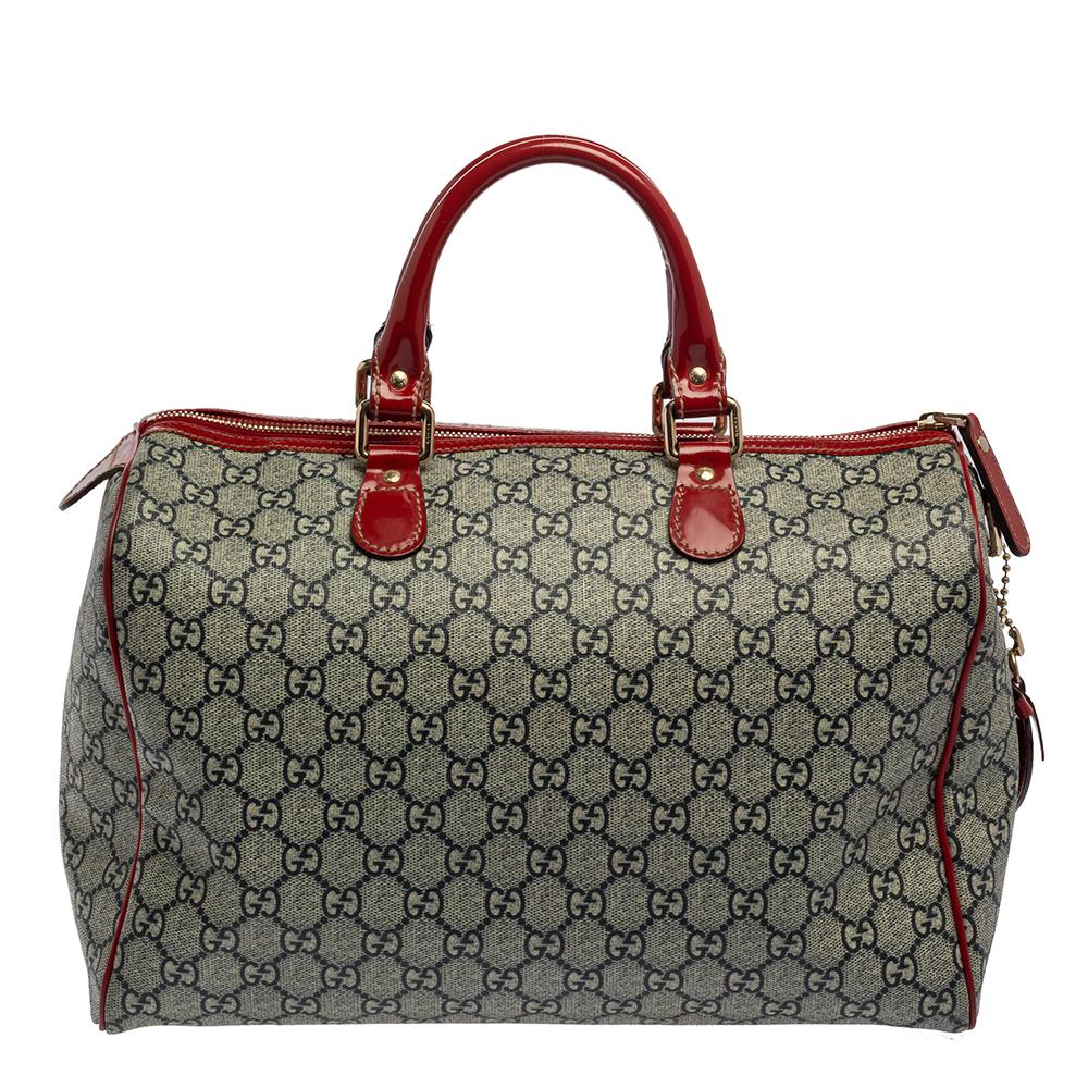 This Boston bag is made out of the GG Supreme Canvas with red patent leather trims. Accented with gold-tone hardware and brand logo, the top zip closure opens to a spacious canvas-lined interior that features a patch pocket. The purpose of the Gucci