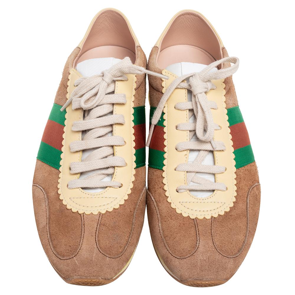 Make a style statement with these Gucci sneakers. They are made from leather and suede and accented with the Gucci web detail at the sides. These lace-ups feature rubber soles and leather lined insoles.

Includes: Original Dustbag

