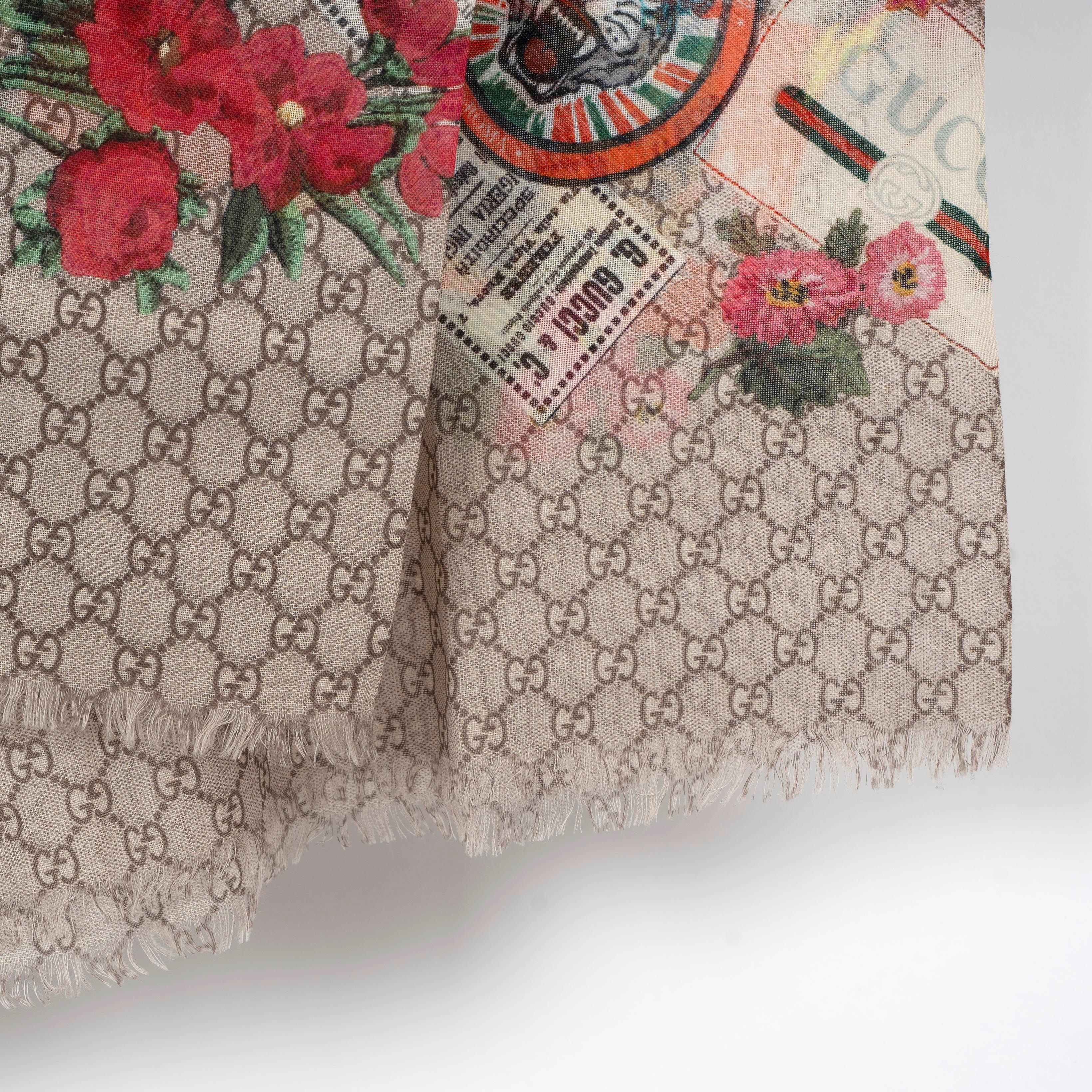 This 100% authentic Gucci Courrier shawl is crafted from beige and brown GG Supreme wool (please note the content tag is missing), showcasing the iconic GG pattern. Featuring multicolor travel-inspired patches and finished with fringed edges, this