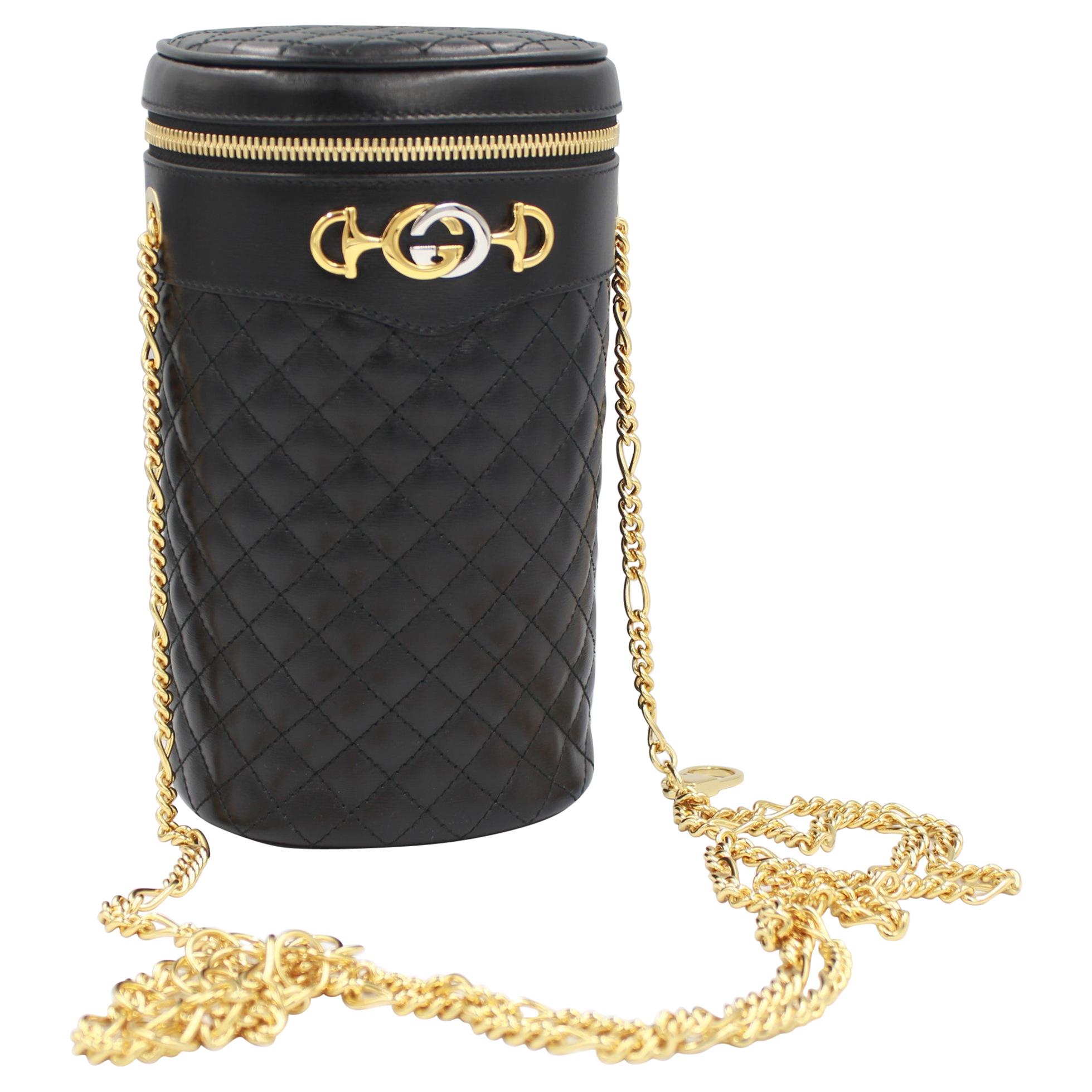 Gucci Belt bag / Cross body bag in black leather and gold chains. For Sale