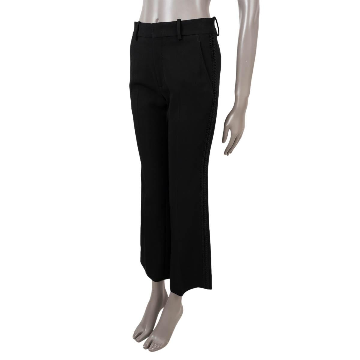 100% authentic Gucci passementerie trim stretch cady pants in black acetate (69%), cotton (19%) and polyester (8%). Feature a flared, cropped leg, belt loops and two slit pockets on the sides and two slit pockets on the back. Open with one hook and