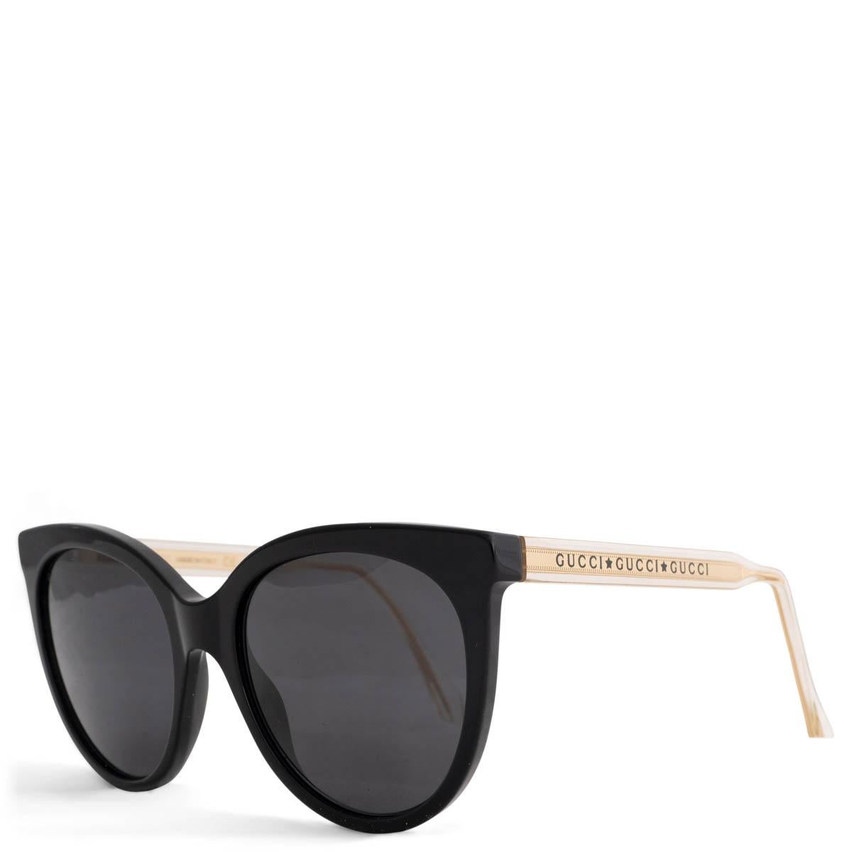 100% authentische Gucci Sonnenbrille mit Katzenaugen aus schwarzem Acetat. Mit goldfarbenen Bügeln mit Logo und grauen Gläsern. Sie wurden getragen und sind in ausgezeichnetem Zustand. Kommt mit Etui.

Messungen
Modell	GG0565S 001
Breite	14cm
