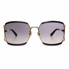 Gucci, schwarze und goldene Sonnenbrille mit quadratischem Rahmen