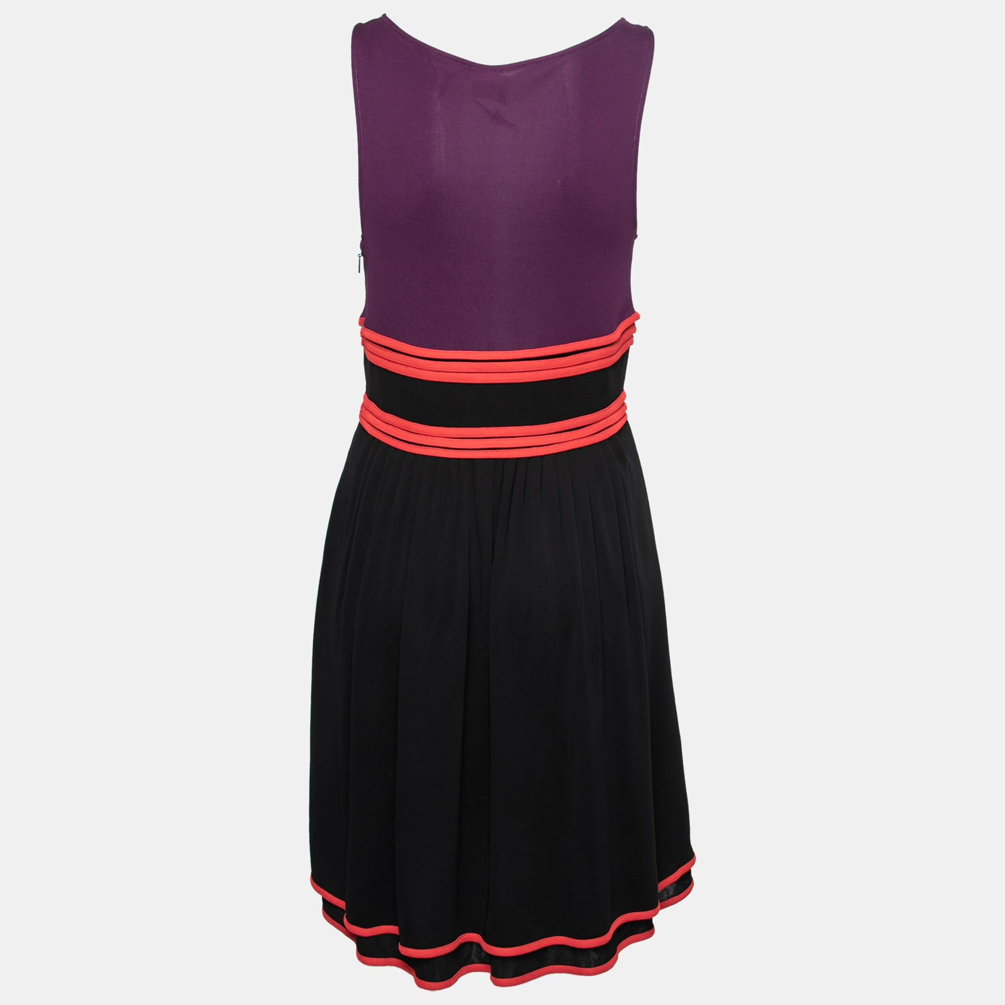 This dress from the House of Gucci proves to be the best pick for casual use. Crafted using black-purple knit fabric, this dress is highlighted with a plunging neckline and a sleeveless style. Match it with comfy flat sandals and a sling bag to head