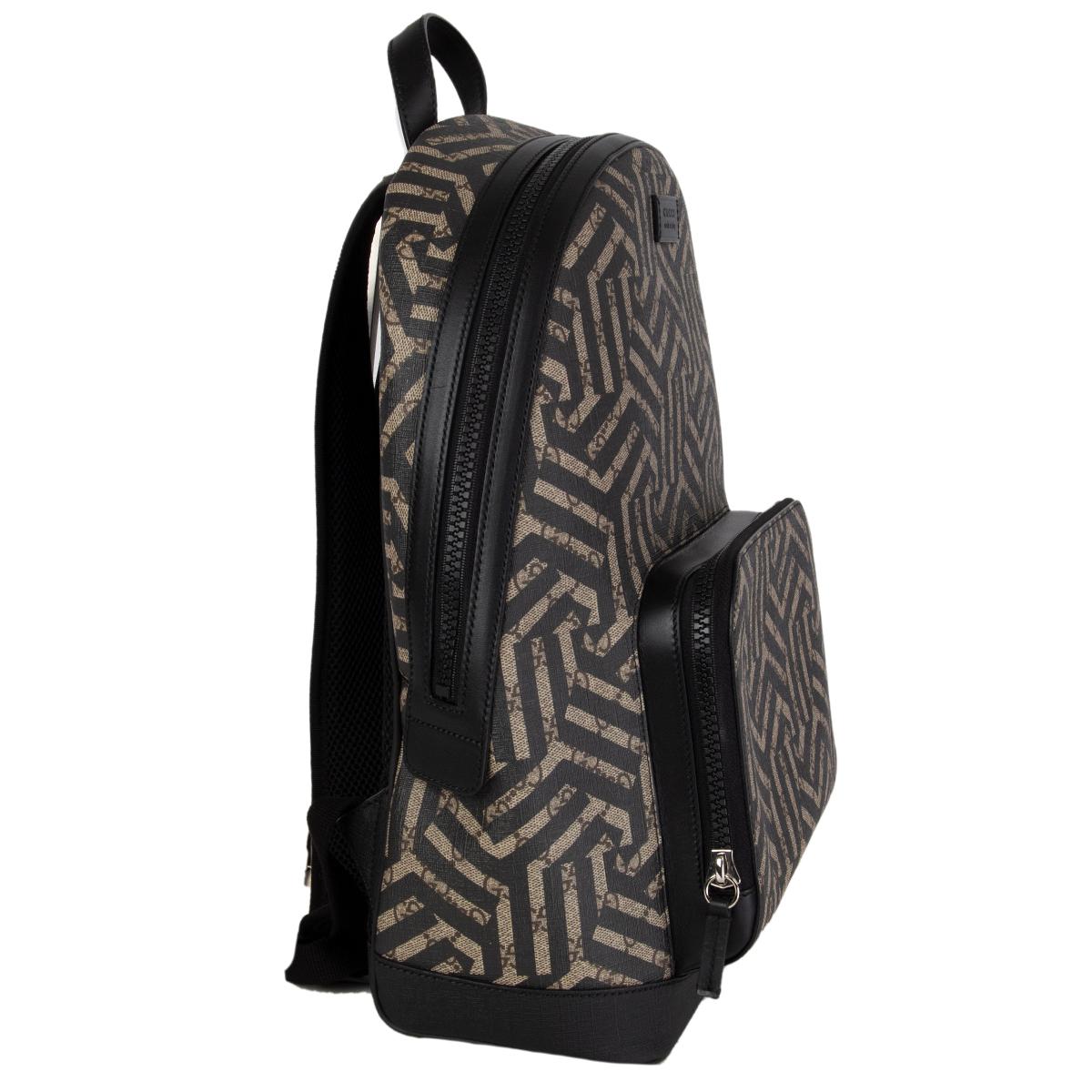 Gucci 'Caleido' backpack in taupe, brown and black GG monogram canvas featuring zipper front pocket. Opens with a zipper on top and is lined in brown microfibre with one padded laptop pocket against the back and two small open pockets against the