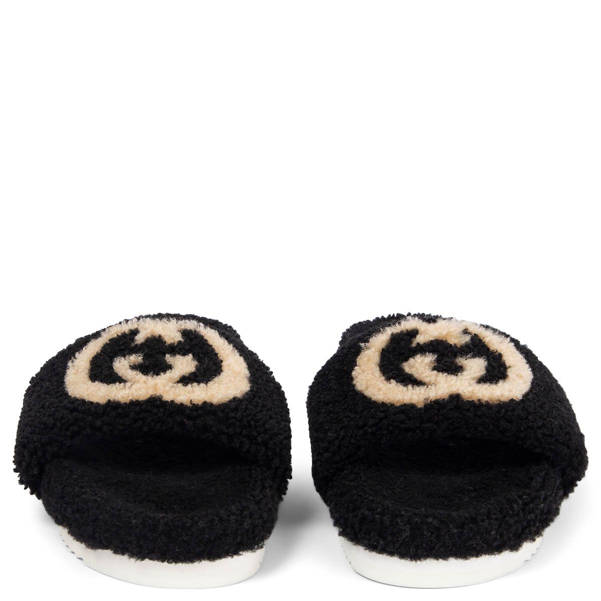 100% authentic Gucci Eileen Teddy Shearling slides in black with Interlocking GG logo set on white rubber soles. Have been worn and are in excellent condition. Come with dust bag. 

Measurements
Imprinted Size	41
Shoe Size	41
Inside Sole	26cm
