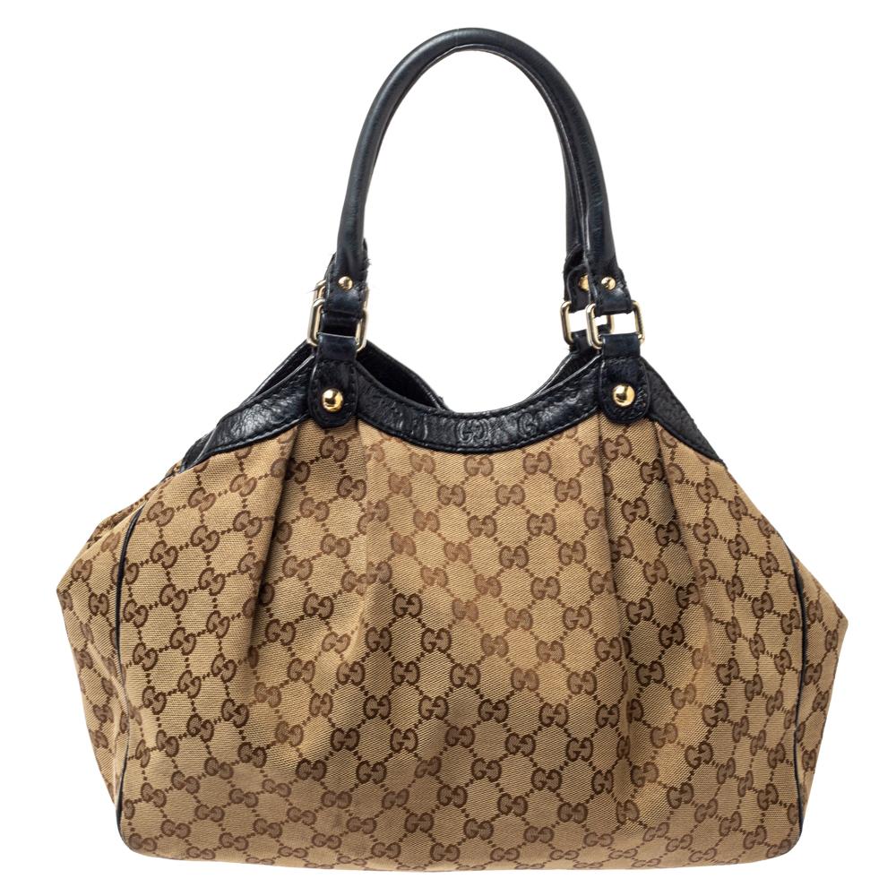 This chic and sophisticated Sukey tote by Gucci is one you wouldn't want to miss out on. With its sleek design and roomy interior, this bag can easily hold all your daily essentials. Tote on your arm with the dual handles and flaunt your