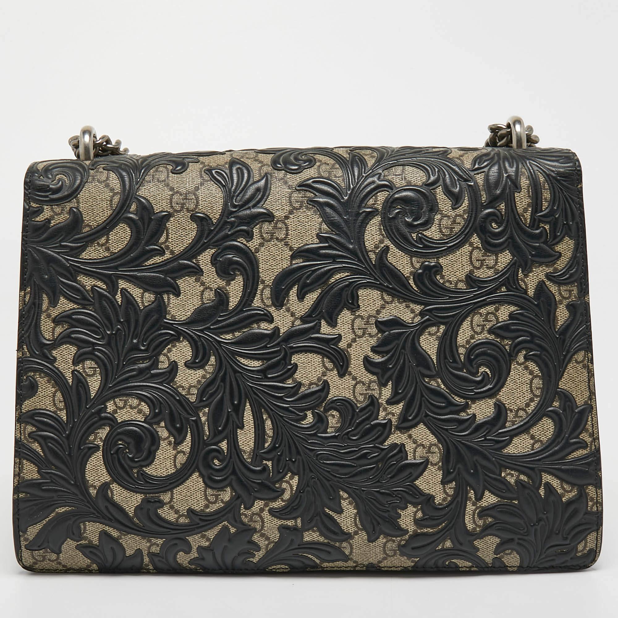 Gucci's Dionysus collection is inspired by the Greek God Dionysus, who is believed to have crossed the Tigris river on a tiger sent to him by Zeus. This creation has been made from GG Supreme canvas along leather with striking Arabesque detailing