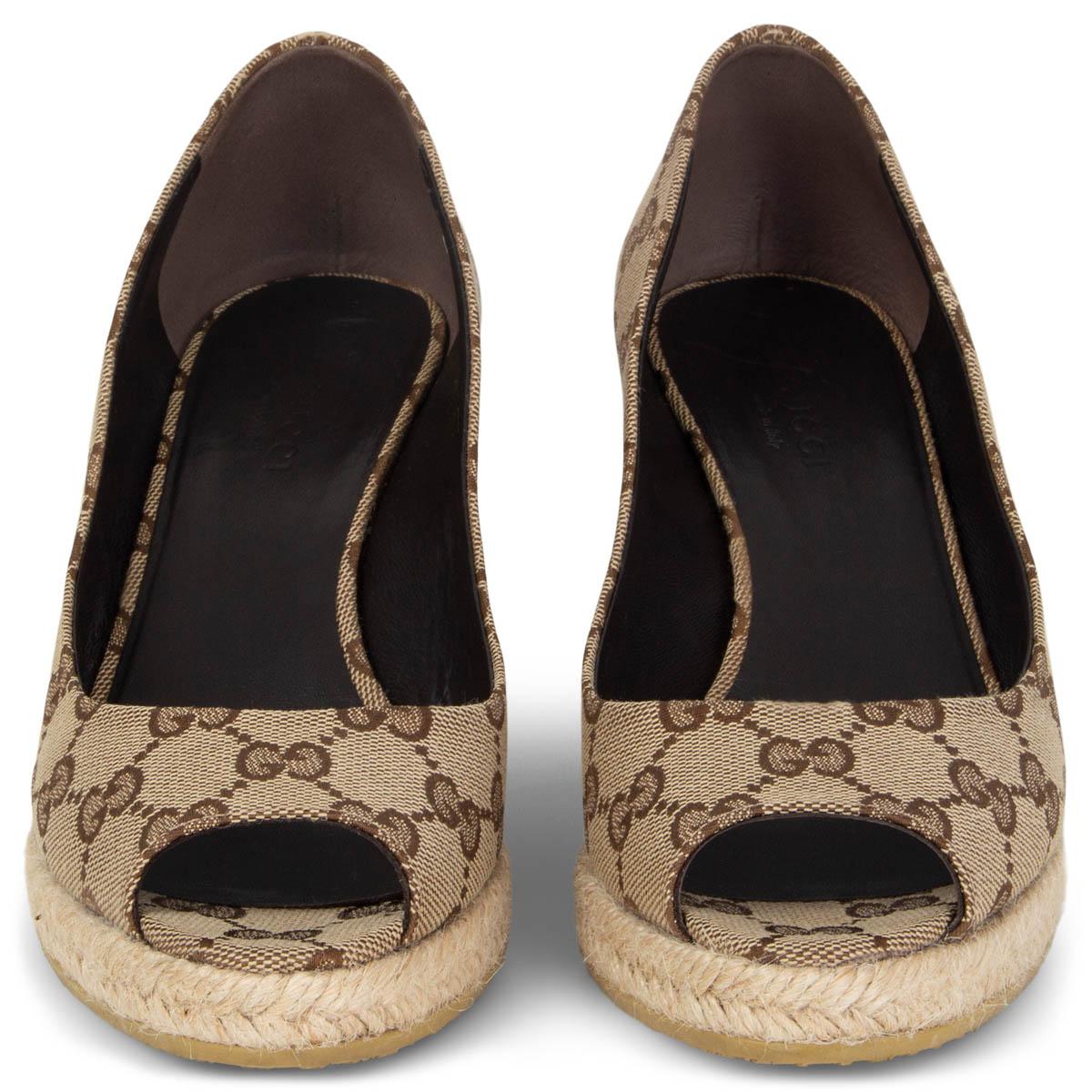 100% authentic Gucci espadrille wedges in brown and beige monogram canvas with raffia sole. Have been worn and are in excellent condition. 

Measurements
Imprinted Size	36.5
Shoe Size	36.5
Inside Sole	23.5cm (9.2in)
Width	7.5cm (2.9in)
Heel	6cm