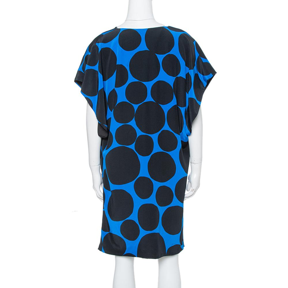 Look your fashionable best when you wear this lovely Gucci dress. Tailored from silk, the mini dress has draped details and polka dots all over. Trust this black and blue to keep you in style and comfort always.

