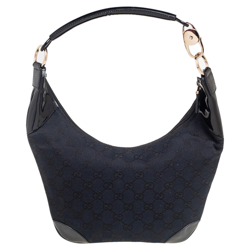 This Gucci hobo is stylish and functional. It is crafted in Italy and made from GG canvas and patent leather. It is great for everyday use. It is styled with a single handle, nylon interior, and gold-tone hardware. Grab this beauty now.