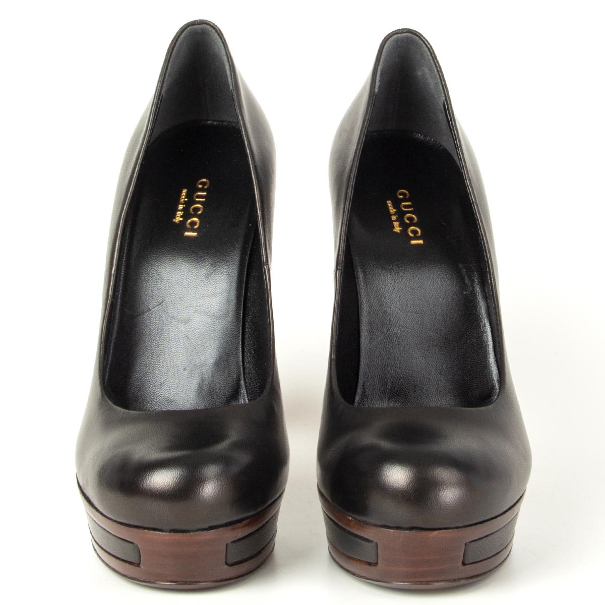 100% authentic Gucci pumps in black calfskin with brown platform sole. Brand new. Come with dust bag. 

Measurements
Imprinted Size	35.5
Shoe Size	35.5
Inside Sole	23.5cm (9.2in)
Width	7.5cm (2.9in)
Heel	12.5cm (4.9in)
Platform:	2.5cm (1in)

All our