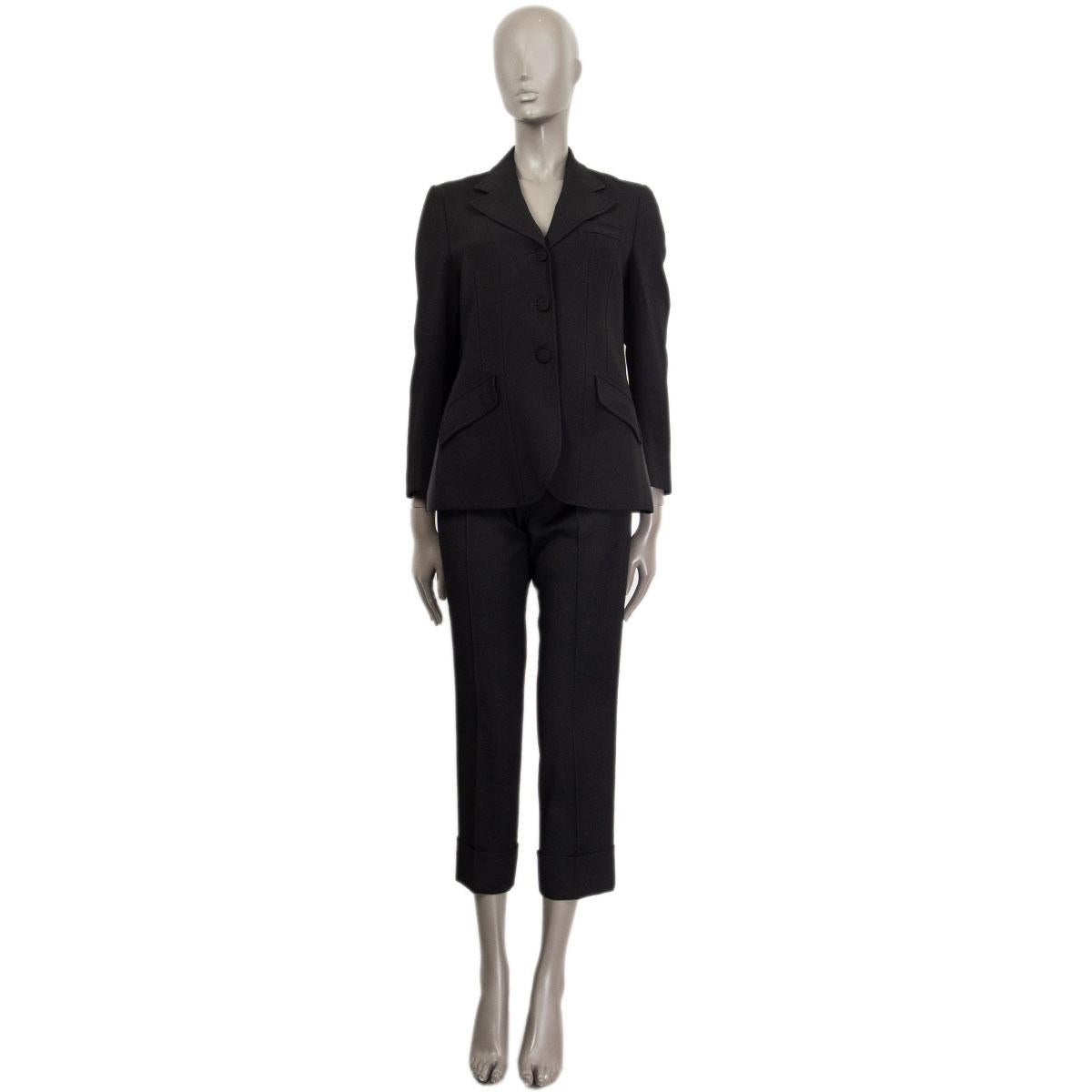 100% authentic Gucci single breasted blazer in black cady viscose (with 3% elastane) and satin inserts on the side (please note that content tag missing) with notch collar and three pockets on the front. Closes with one button at the neck-line and