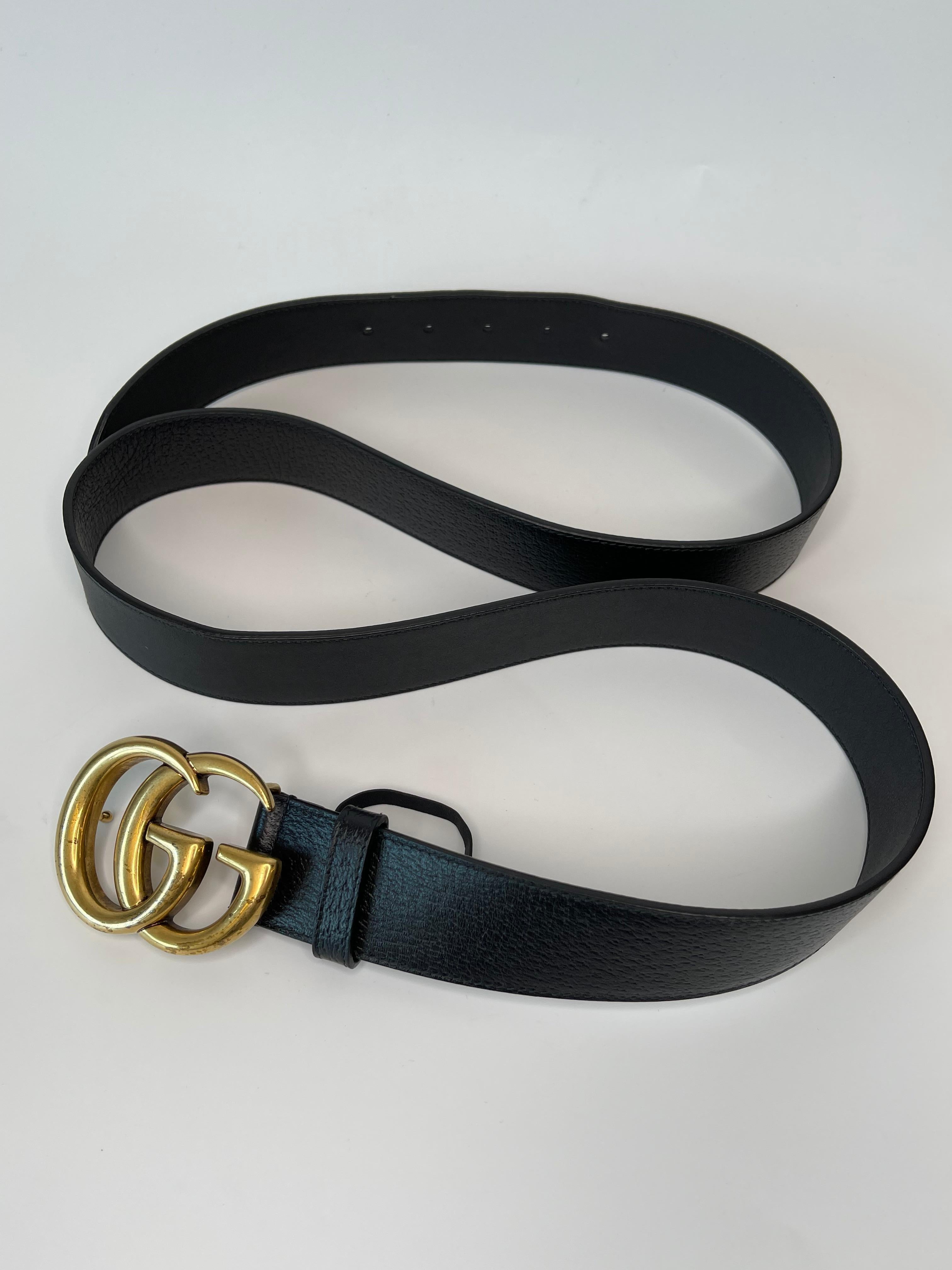This belt is made with calfskin leather in black and features an aged gold interlocking GG buckle. 

COLOR: Black
ITEM CODE: 406831-DJ20T
MATERIAL: Leather
MEASURES: L 51” x W 1.5”
SIZE: 115/46
COMES WITH: Gucci box, dust bag.
CONDITION: Good