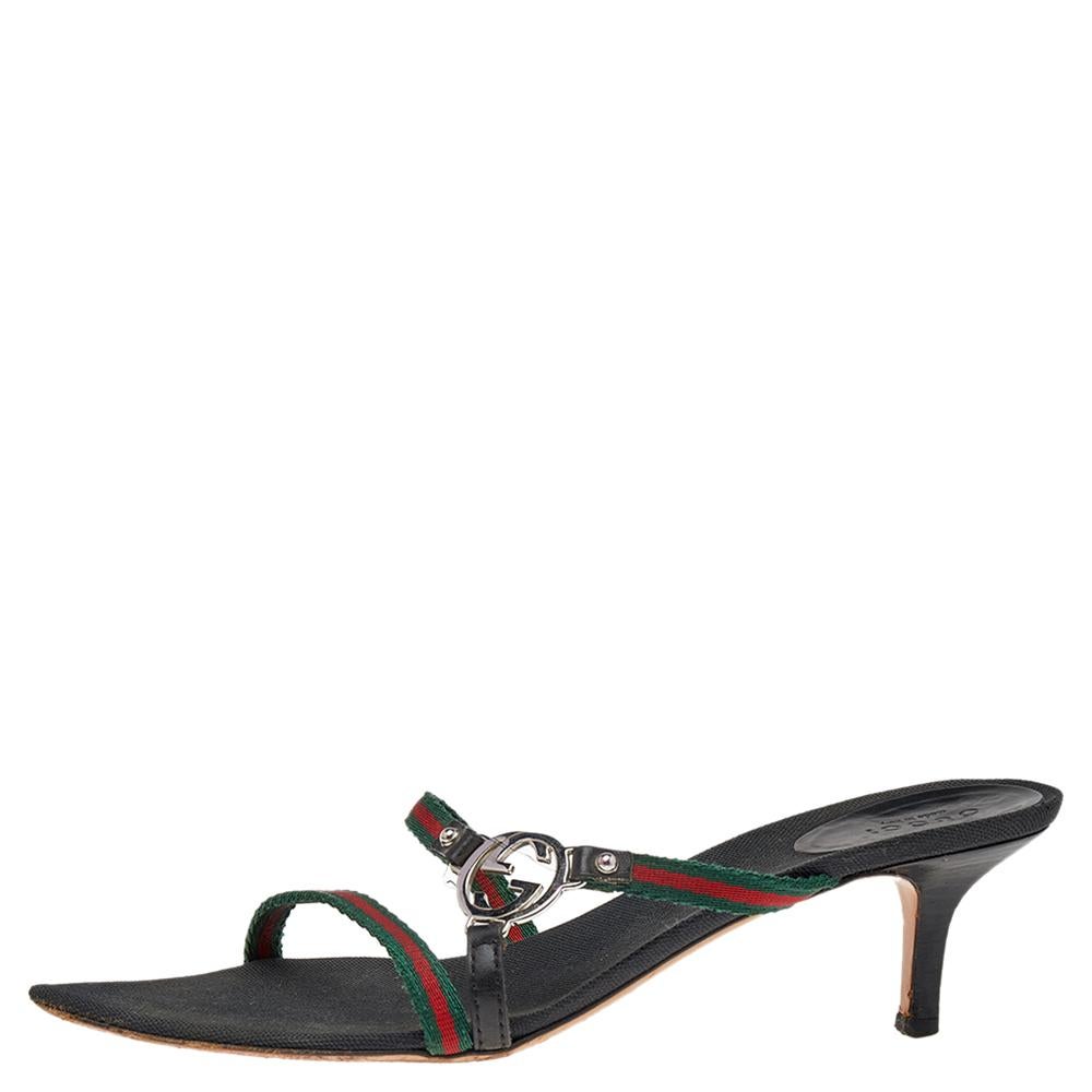Set on comfortable kitten heels, these Gucci sandals feature a thong silhouette. The pair carries signature web straps with GG accents detailed on the front. Wear for summer evening outings with a short dress or cropped pants.