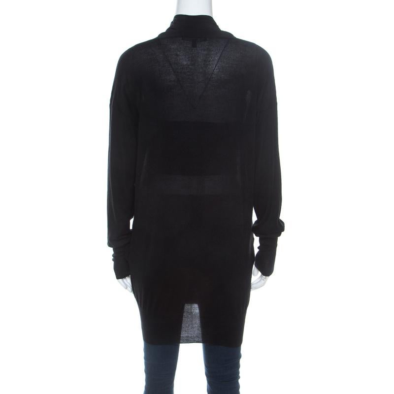 From Gucci comes this prize of a piece that is made from cashmere and silk and designed as a double breasted cardigan. The black creation has front buttons and long sleeves. It will not only feel plush in every touch but also keep you warm and in