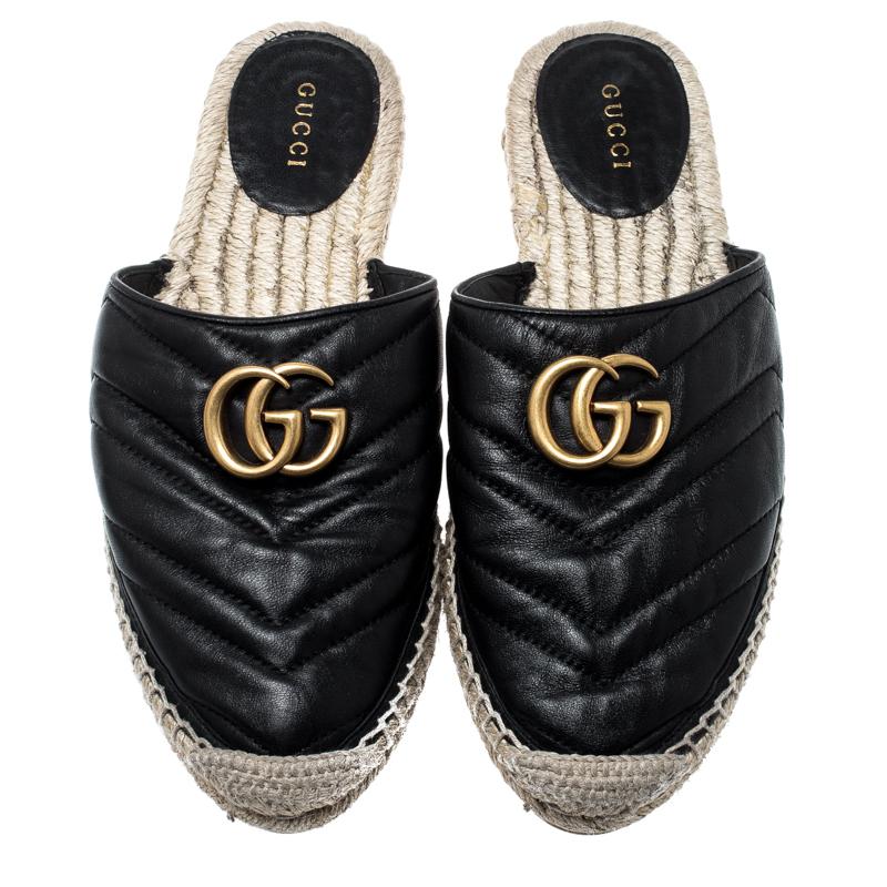 Wear these espadrille flats for a casual outing with friends. It is crafted with chevron quilted leather featuring double G motif in gold-tone perched on the vamps. These slides from the house of Gucci are a fine blend of comfort and class. Designed