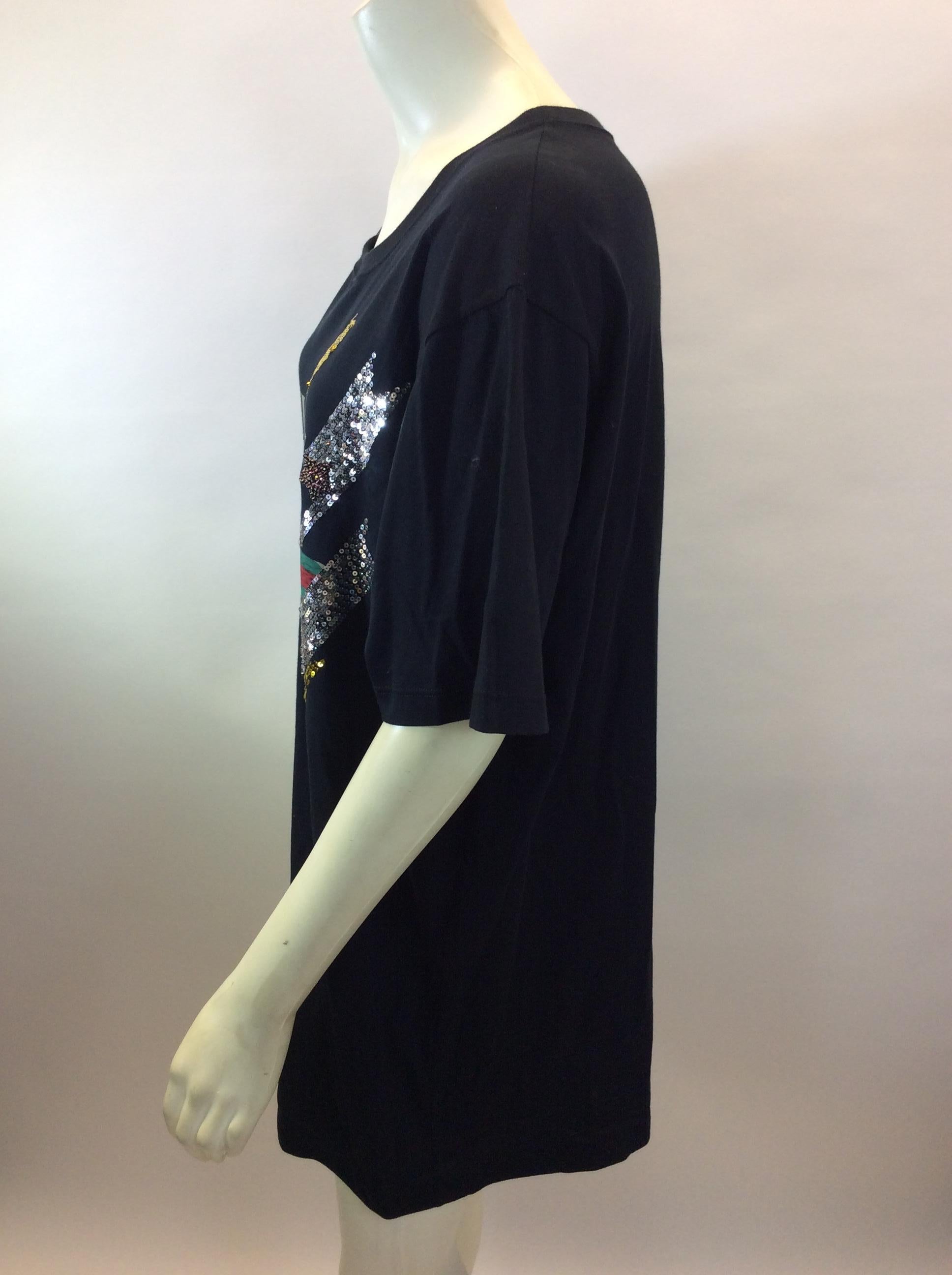 Gucci Black Classic Stripe T-Shirt with Sequin
$950
Made in Italy
100% Cotton
Size Medium
Length 30