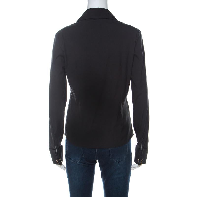 Made by Gucci, a stylish shirt like this one is a fashion must-have. This black shirt with a smooth cotton blend body, a cross-over design to the and long cuff sleeves exhibits a well-balanced blend of comfort and style. Complete with a classic