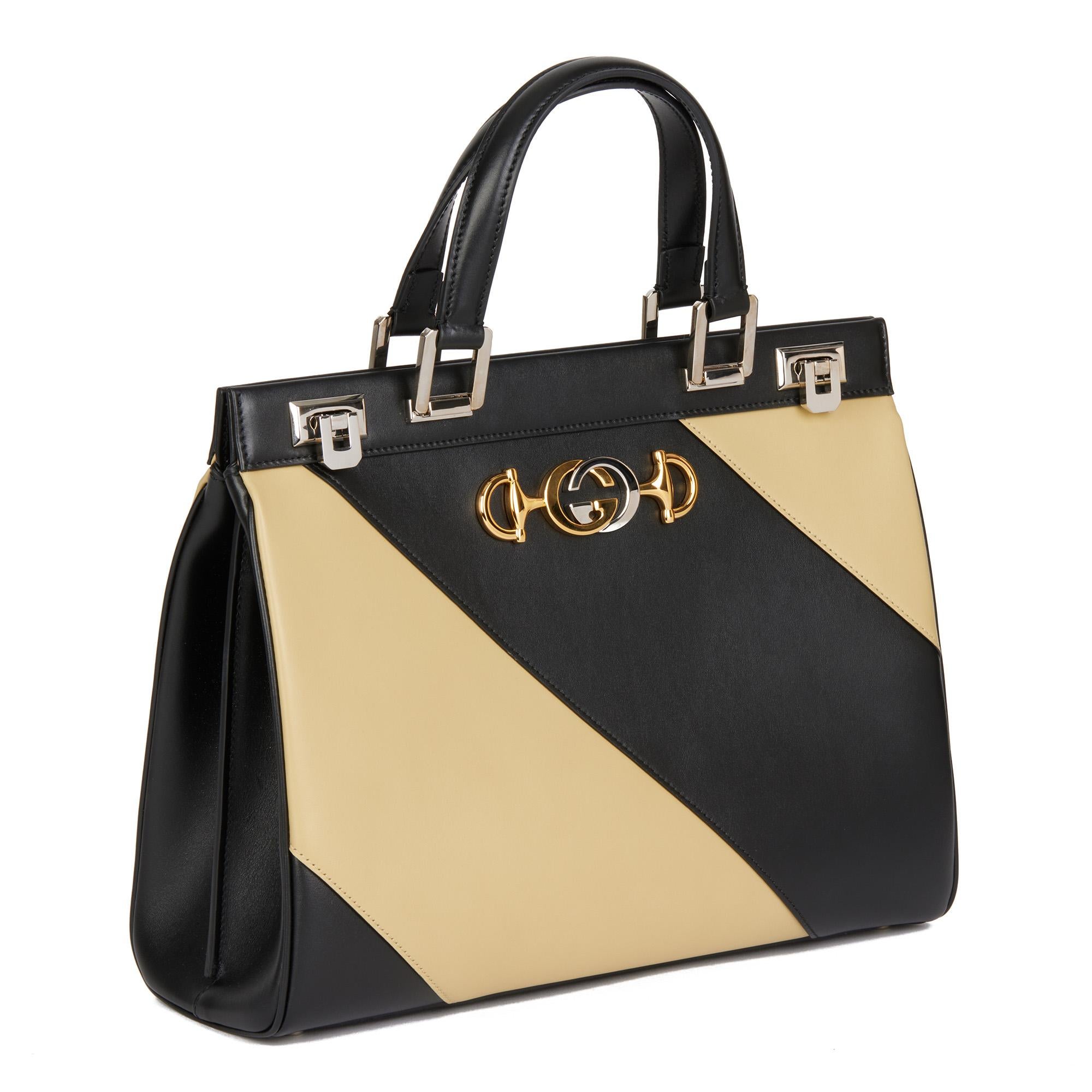 GUCCI
Black & Cream Diagonal Stitched Calfskin Leather Zumi Tote

Serial Number: 564714 520981
Age (Circa): 2021
Accompanied By: Care Booklet, Shoulder Strap
Authenticity Details: Date Stamp (Made in Italy)
Gender: Ladies
Type: Tote,