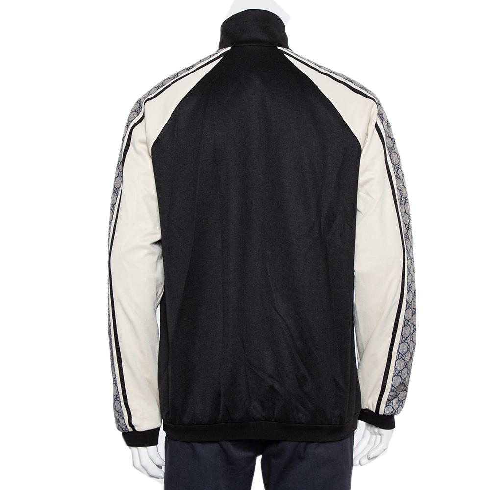 Elevate your closet with this oversized jersey jacket by Gucci. A logo tape detail in GG printed nylon runs down from the shoulders to the long sleeves, equipped with a central zip down closure and two zip pockets. This style features a high