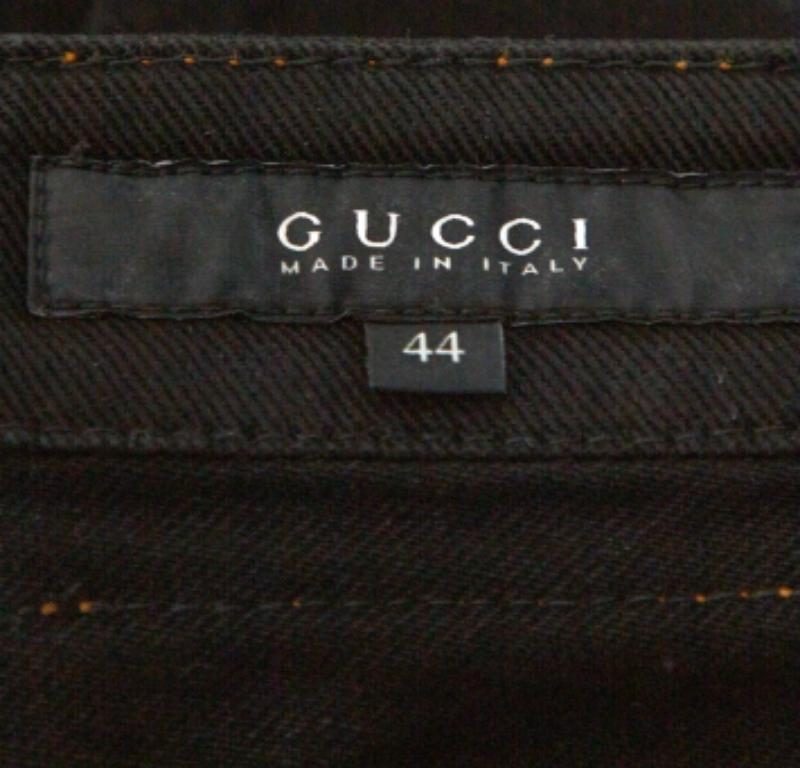 These slim-fit jeans from Gucci are unique and one of a kind. The black denim construction is enhanced with criss-cross lace and button details below the waist and the jeans are equipped with four pockets. They are sure to be a valuable addition to