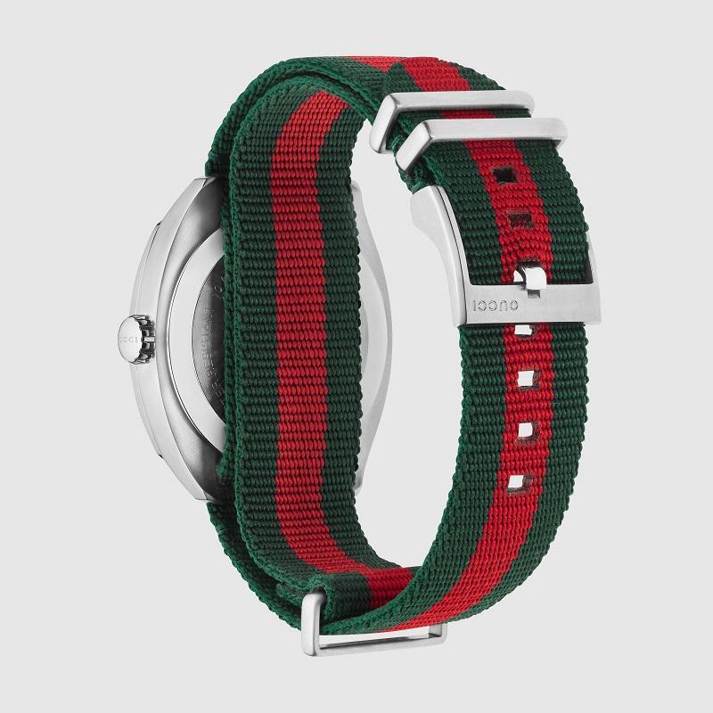 Stainless steel case with a green and red nylon strap. 
Fixed stainless steel bezel. 
Black dial with silver-tone hands and index hour markers. 
Minute markers around the outer rim. 
Dial Type: Analog. Luminescent hands and markers. 
Date display at