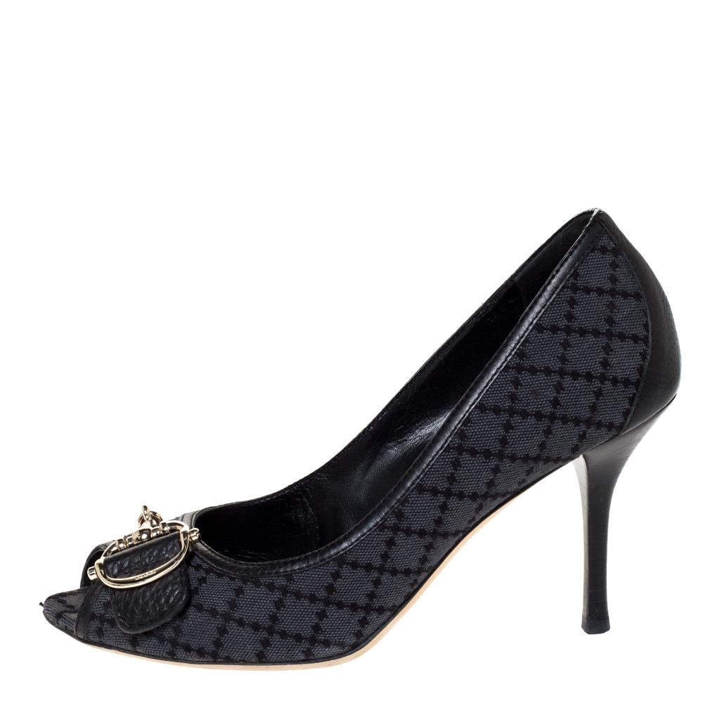 These iconic pumps come from the house of Gucci. Equipped with a signature appeal, they have been crafted from diamante canvas and flaunt leather trims. They carry a black hue, the bit motifs on the uppers in gold-tone hardware, platforms, peep toes