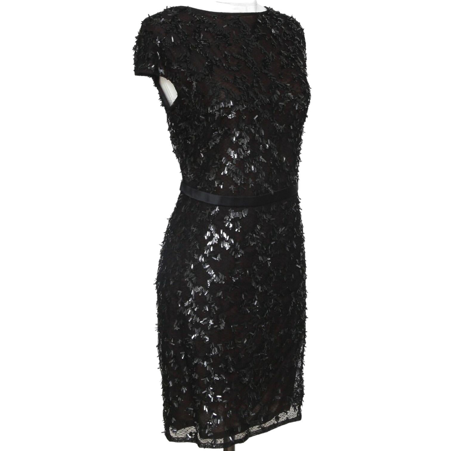 GUARANTEED AUTHENTIC GUCCI RUNWAY BLACK PAILLETTE NETTING DETAILED COCKTAIL DRESS

Design:
 • Stunning black cocktail dress with a netting and pallette design throughout.
 • Cap sleeve.
 • Rear low cutout and zipper closure.
 • Maroon silk lining
