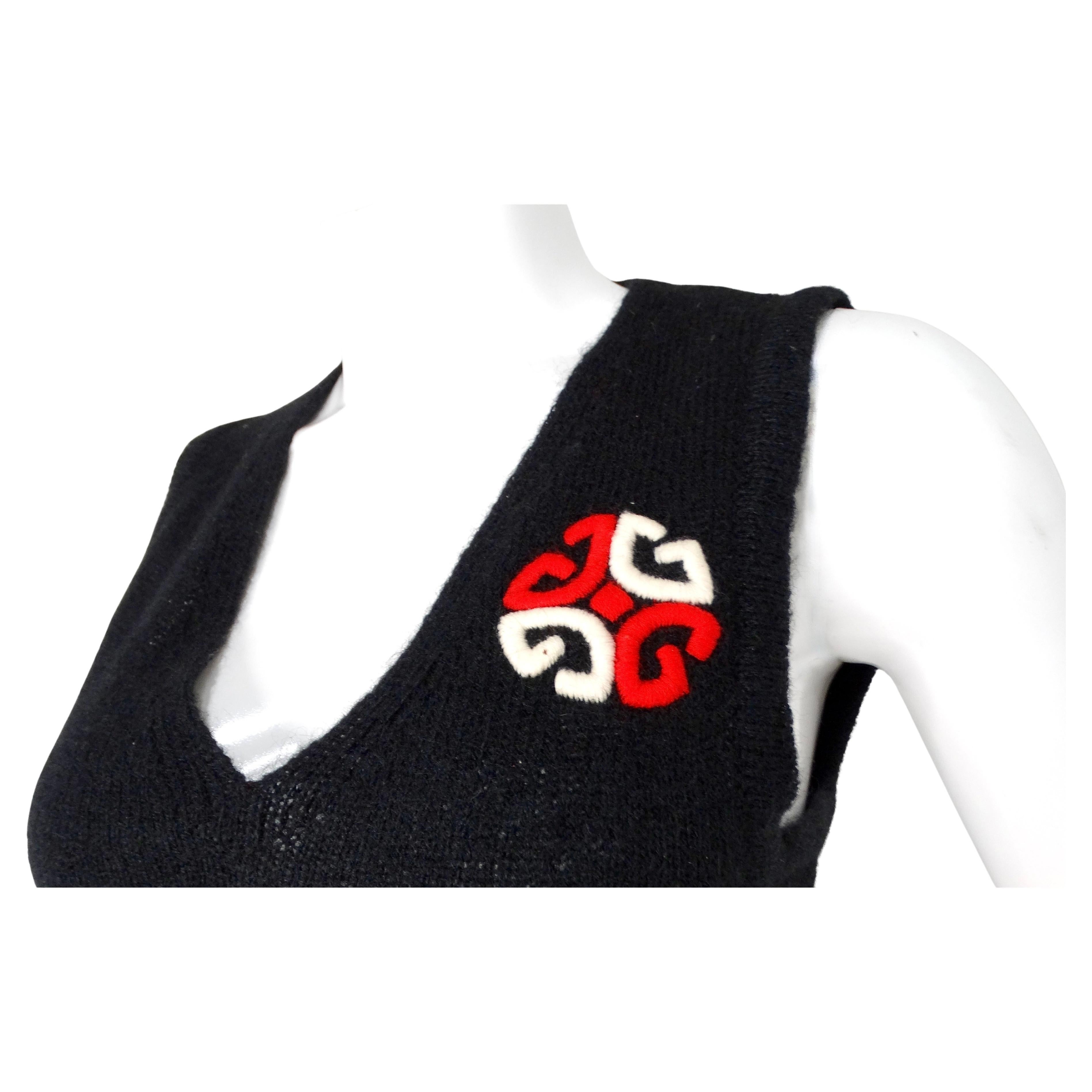 The Gucci Black Embroidered GG Logo Wool Blend Vest Top from the circa 1970s is a striking vintage piece that exudes timeless elegance and classic Italian craftsmanship. Crafted from a luxurious wool and acrylic blend, this sleeveless vest features