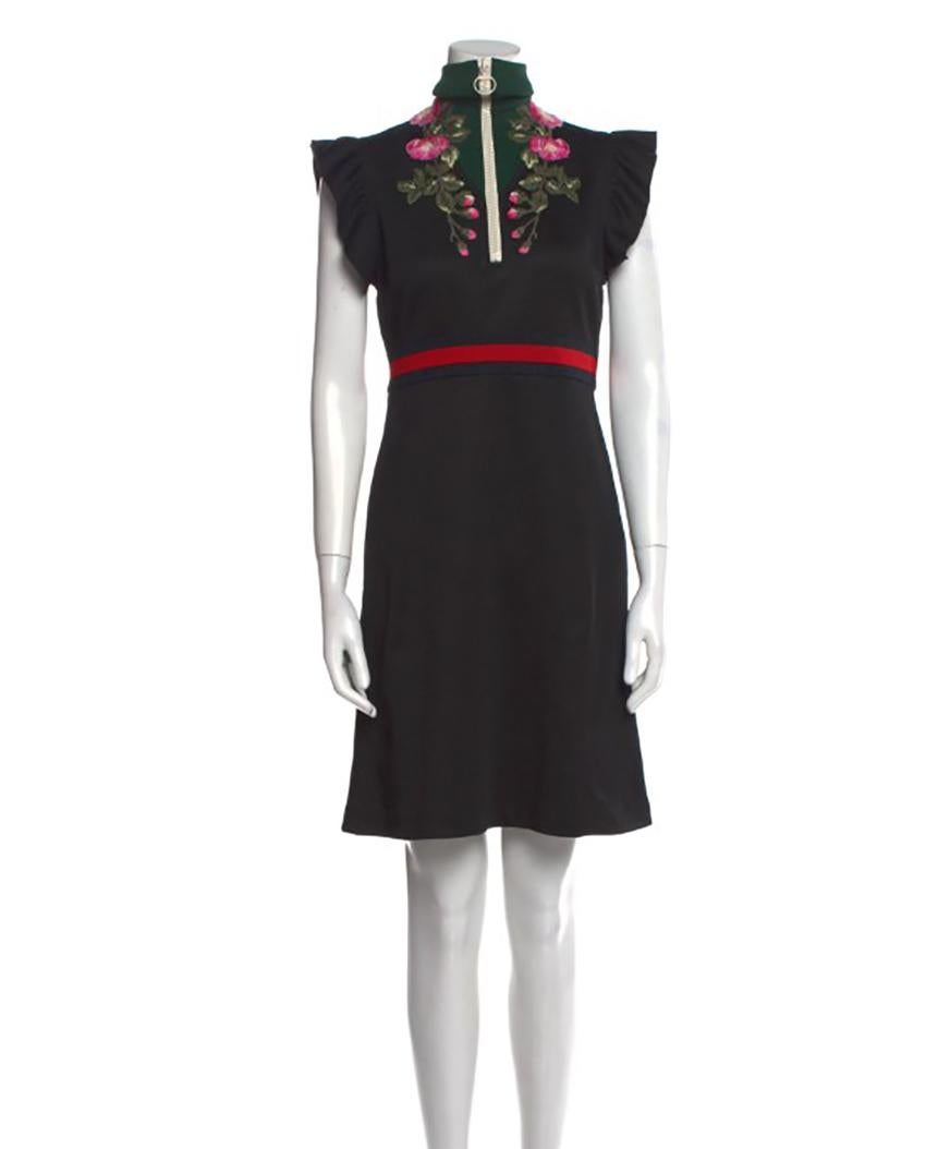 GUCCI

BLACK FLORAL EMBROIDERED FLARED DRESS 
Gucci A-Line Dress
From the Fall/Winter 2017 Collection by Alessandro Michele

Sylvie Web Accent
Embroidered Accent
Short Sleeve with Mock Neck
Concealed Zip Closure at Side

Content: 55% Polyester, 45%