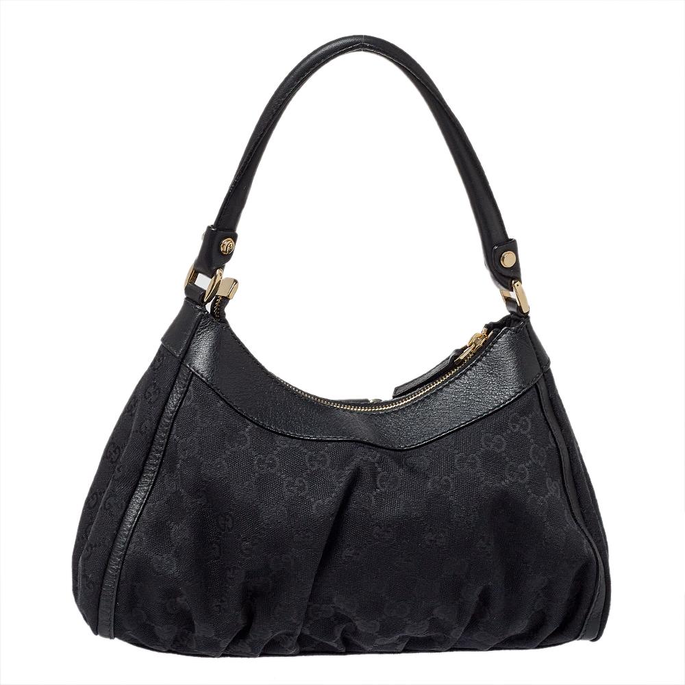 Coming from the house of Gucci, this bag is ideal for you. A favorite of the fashion elite, this black-hued bag is great for a host of occasions. It has been crafted from GG canvas & leather and styled with D-ring detail, a single handle and a