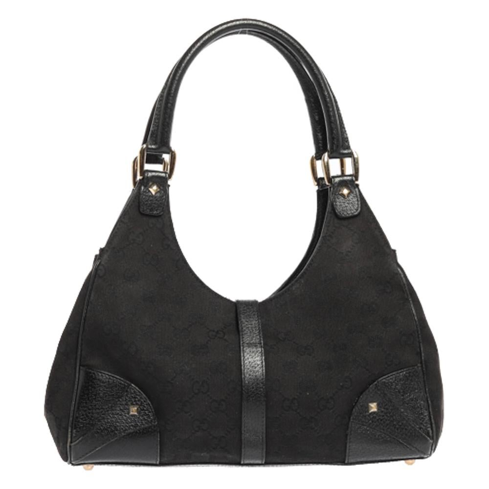 Gucci brings to you this amazing Bardot shoulder bag that is smart and modern. Made in Italy, this bag is crafted from GG canvas & leather and features the signature lock in gold-tone on the front. The fabric-lined interior has enough space to hold