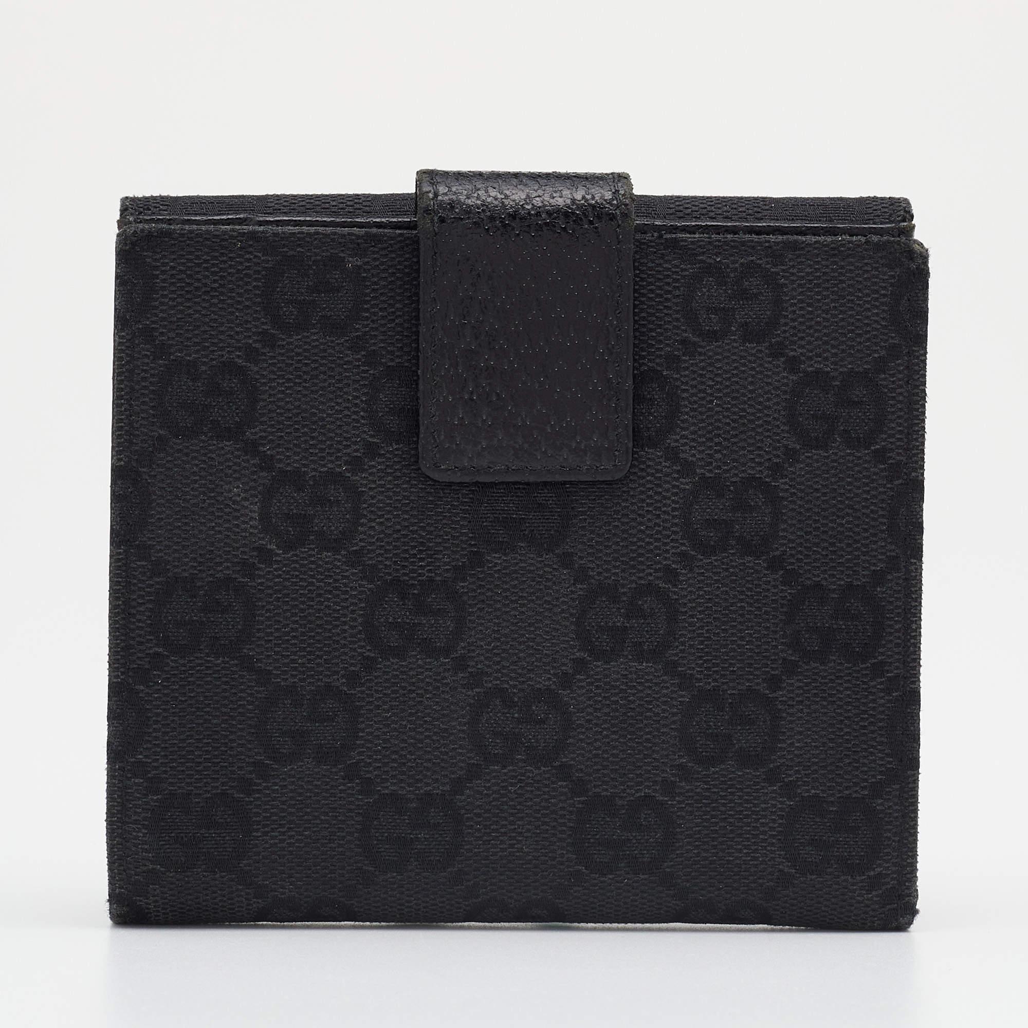 This wallet by Gucci has been crafted from GG canvas and leather and detailed with gold-tone studs on the front flap closure. It opens to reveal multiple slots and slip pockets to neatly arrange your cards and cash.
 
Includes: Original Box

