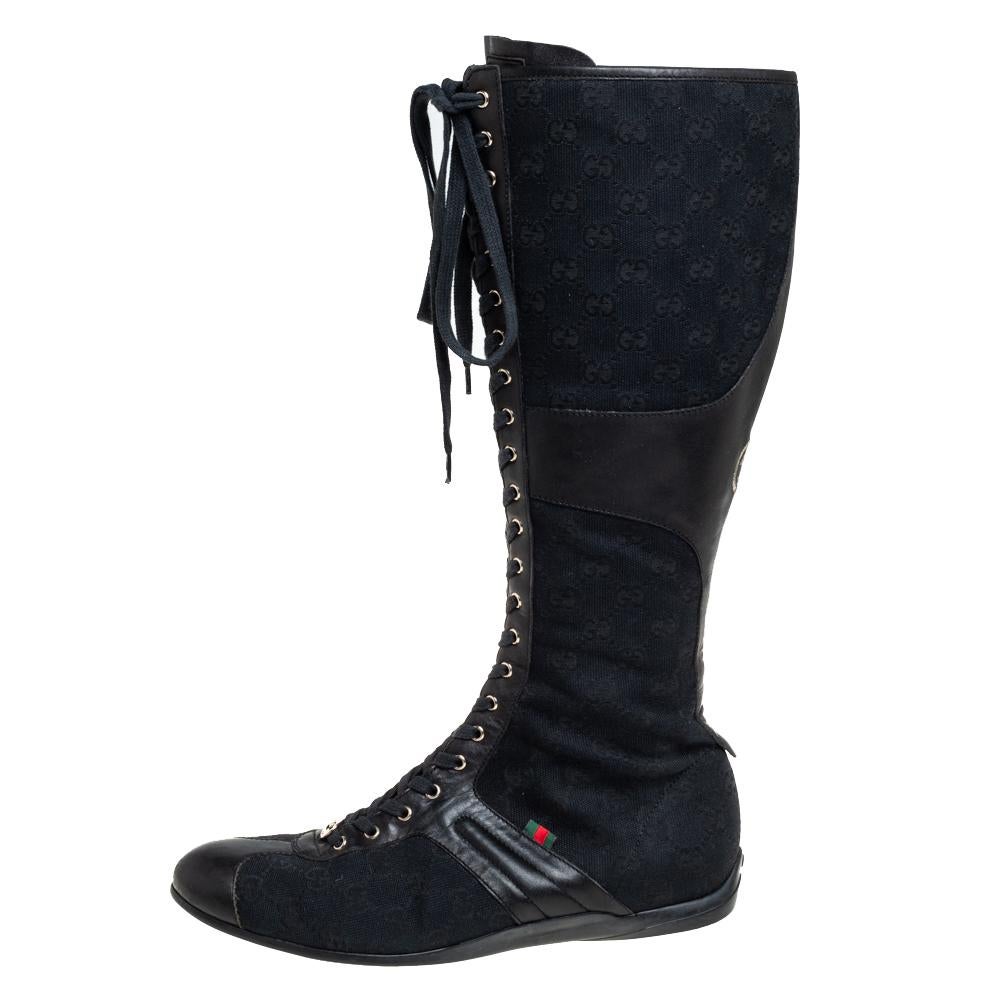 These black Gucci boots are an example of quality craftsmanship blended with perfection. Crafted from GG canvas and leather into a knee-length silhouette, they are adorned with the label's logo for a signature finish.

