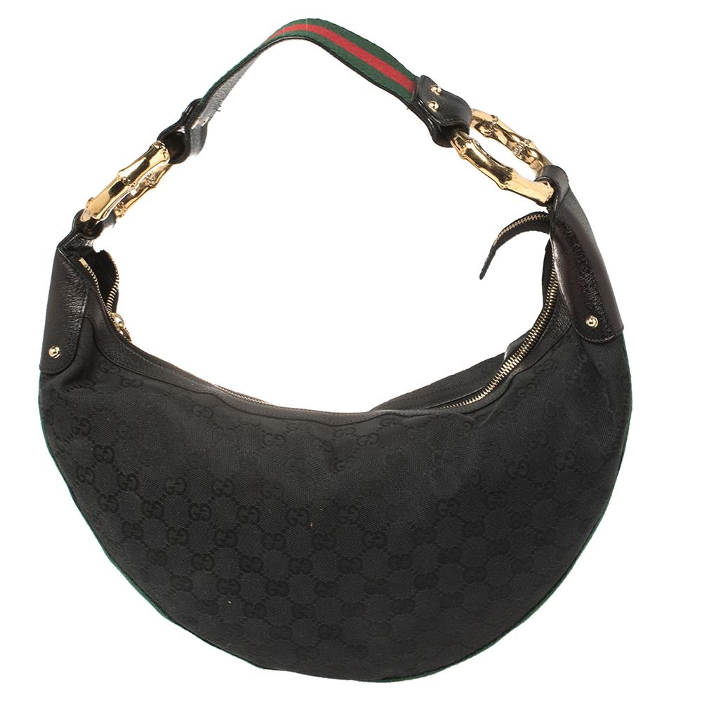 You are going to love owning this hobo from Gucci as it is well-made and brimming with luxury. The bag has been crafted from GG canvas and enhanced with leather trims. It is complete with a single handle, bamboo rings, and a well-sized interior for