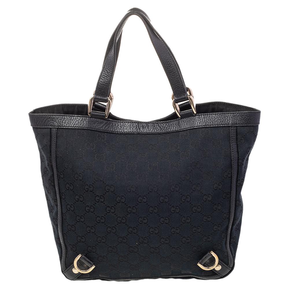 Gucci brings to you this amazing Abbey tote that is smart, versatile, and modern. Made in Italy, this tote is crafted from GG-printed canvas and features dual leather handles. The bag comes with a canvas-lined interior with enough space to hold all