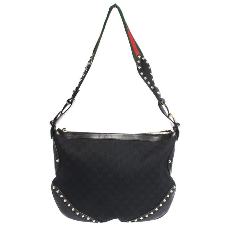 Take your style a notch higher with this Pelham hobo from Gucci. Cut out from GG canvas and leather, the bag features a web detail shoulder strap, a spacious fabric interior and studs on the exterior. This hobo is perfect for daily use.

Includes:
