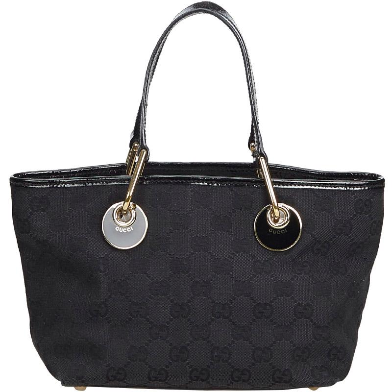 Designed using superior quality jacquard design, this tote bag by Gucci is characterized by chic buckle embellishments that impart a look of sophistication. The rectangular silhouette, top zip closure and dual flat straps make sure that all your