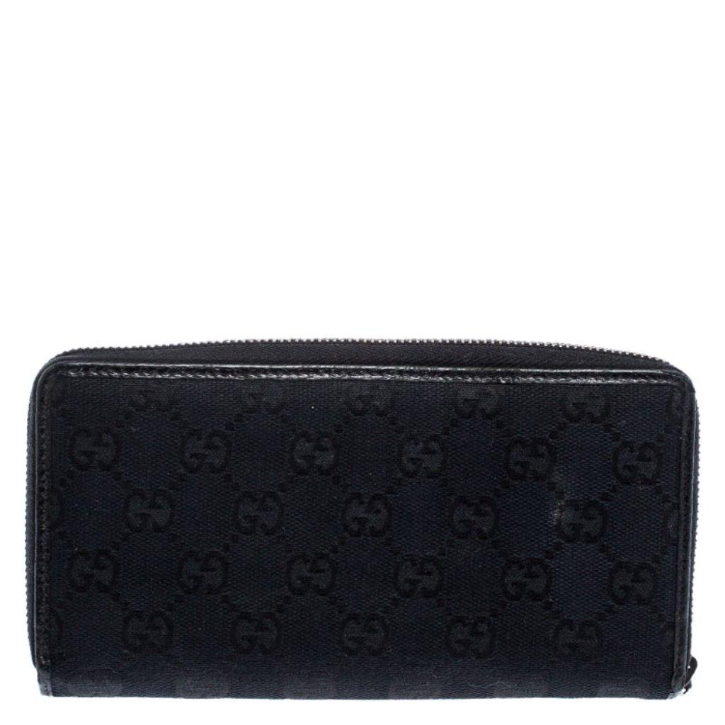 Chic and fabulous, this zip around wallet is from Gucci. Crafted from GG canvas, the interiors are leather and fabric lined. It comes with a zipper pull that opens to multiple card slots, a zipped coin pocket, and two open compartments to neatly