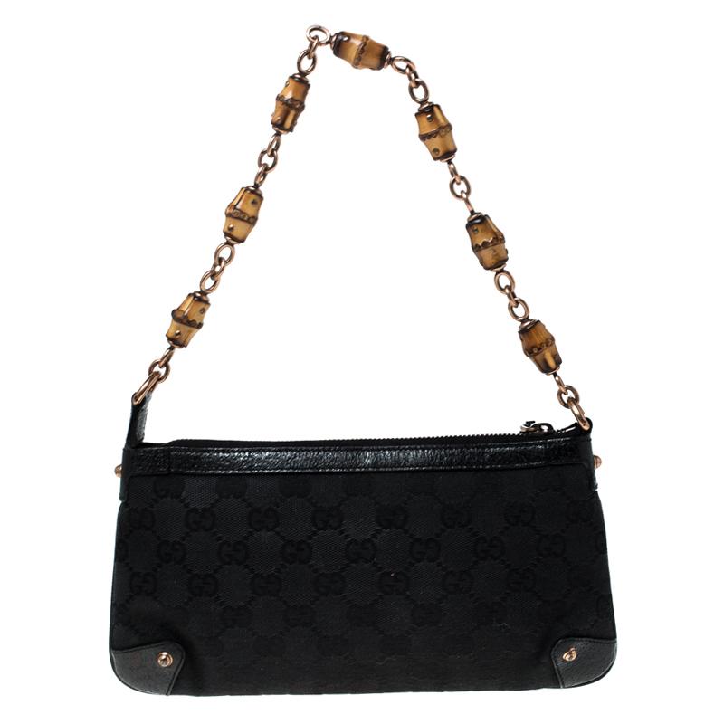 This handy Pochette bag is from the house of Gucci. It has been crafted from signature GG canvas and is equipped with a fabric interior which will house the essentials you cannot do without. The pochette is complete with a bamboo detailed top